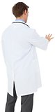 Young doctor in lab coat gesturing