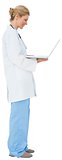 Blonde doctor in lab coat using laptop