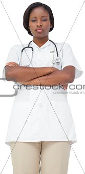 Young nurse in tunic with arms crossed