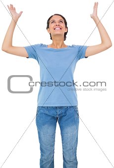 Happy young casual brunette gesturing