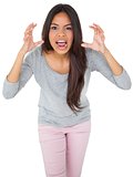 Angry casual young brunette shouting