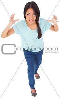 Angry young casual brunette gesturing