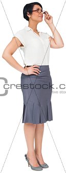 Thoughtful brown haired businesswoman in skirt