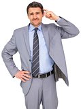 Thinking businessman in grey suit