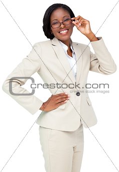 Thinking businesswoman in cream suit