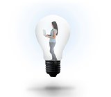 Woman holding laptop in light bulb