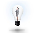 Thinking businesswoman in light bulb