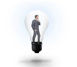 Thinking businessman in light bulb