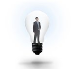Thinking businessman in light bulb