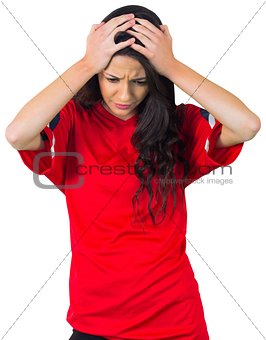 Disappointed football fan in red