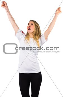 Pretty football fan in white cheering