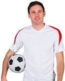 Smiling football fan in white