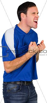 Excited football fan in blue