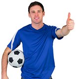 Smiling football fan in blue