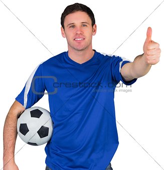 Smiling football fan in blue
