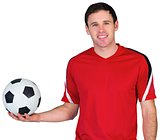 Football fan in red holding ball