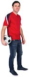 Football fan in red holding ball
