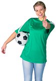 Happy football fan in green