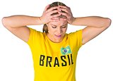 Disappointed football fan in brasil tshirt