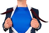 Businessman opening his shirt superhero style