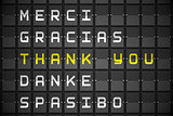 Thank you in languages on black mechanical board