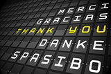 Thank you in languages on black mechanical board