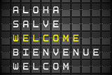 Welcome in languages on black mechanical board