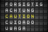 Caution in languages on black mechanical board