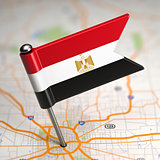 Egypt Small Flag on a Map Background.