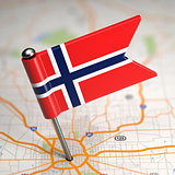 Norway Small Flag on a Map Background.