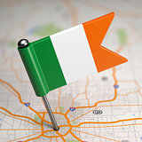 Ireland Small Flag on a Map Background.