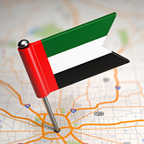 UAE Small Flag on a Map Background.