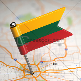 Lithuania Small Flag on a Map Background.