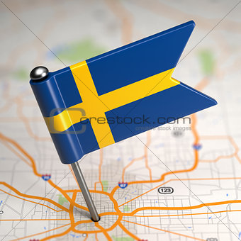 Sweden Small Flag on a Map Background.