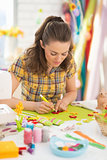 Young woman making easter decoration