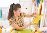 Young woman making easter decoration in studio