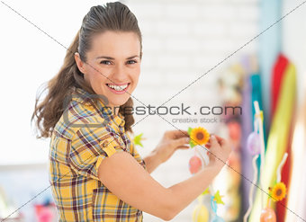 Smiling young woman preparing for easter
