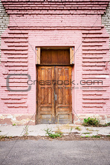 Door in a pink wall
