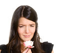 Sorrowful woman clutching a single rose
