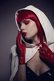 Portrait of mysterious sensual woman wearing white hooded jacket