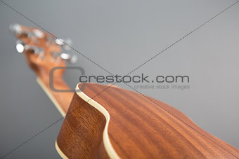 Close-up shot of classic ukulele guitar, back view 