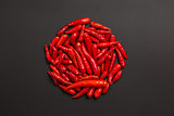 Circle made of non-stem red bird eye chili peppers 