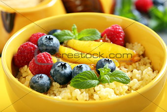 Porridge with berries and fruits - healthy breakfast.
