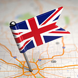 Great Britain Small Flag on a Map Background.