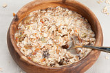 Muesli granola with fruits in wooden bowl