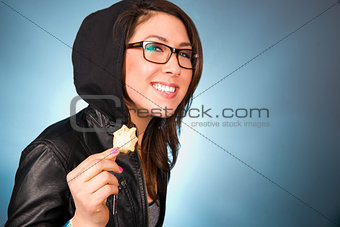 Young Woman Smiles While Chewing a Bite of Chips
