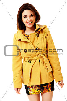 Attractive smiling woman in yellow coat