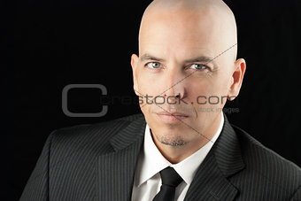 Focused Bald Man In Suit