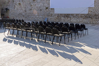 Outdoor cinema and rows of empty black seats in Zadar, Croatia