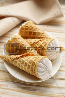 sweet wafer cone filled with vanilla cream